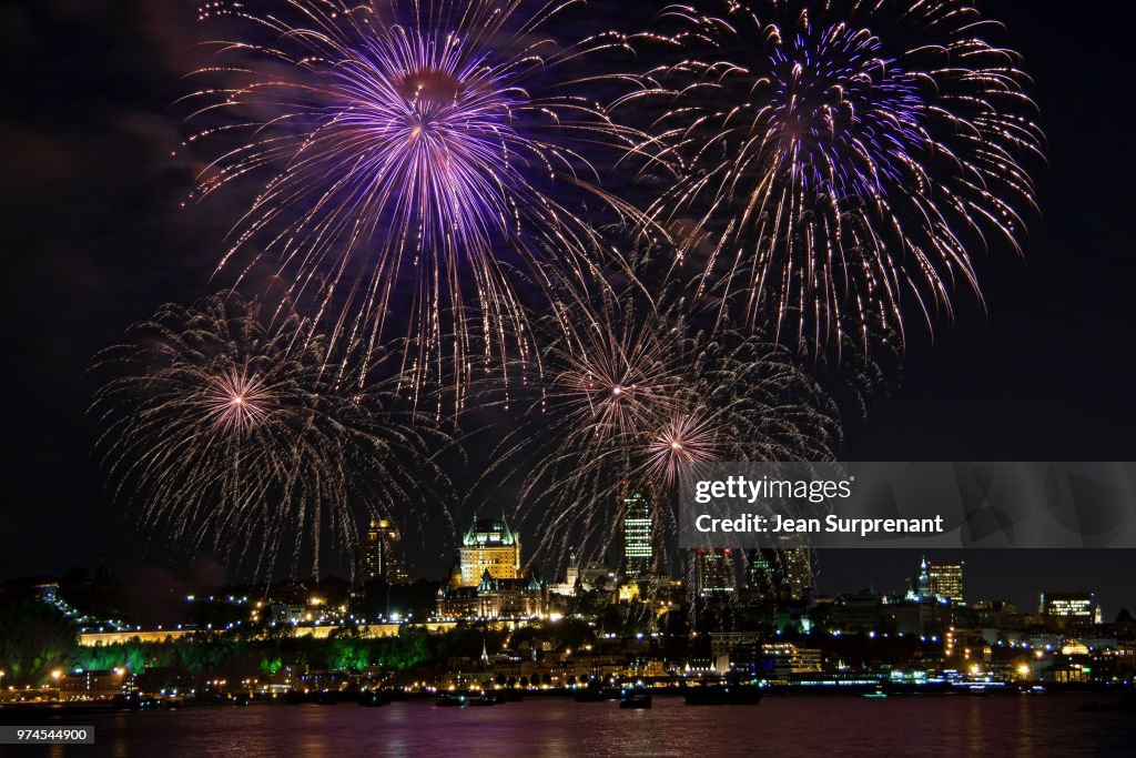 Fireworks display over city waterfront