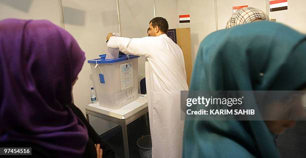 Iraqi expatriates cast their vore for their national general election at a polling station in Dubai on March 5, 2010. Politicians launched into their...