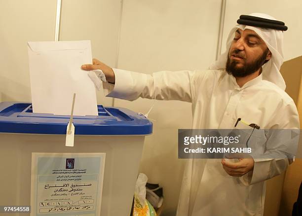 An Iraqi expatriate casts his ballot for the Iraqi general election at a polling station in Dubai on March 5, 2010. Politicians launched into their...