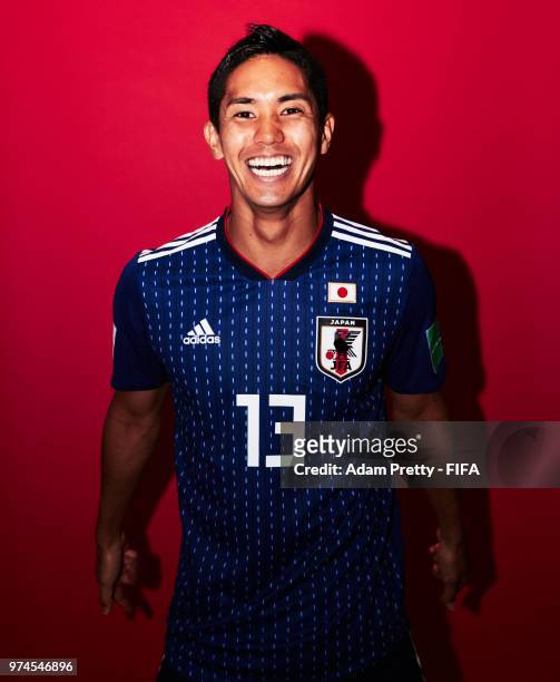 Yoshinori Muto of Japan poses for a portrait during the official FIFA World Cup 2018 portrait session at the FC Rubin Training Grounds on June 14,...
