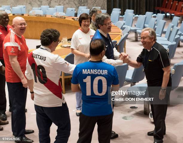 Secretary General António Guterres enters the Security Council chambers wearing a referee uniform before members of the Security Council pose for...