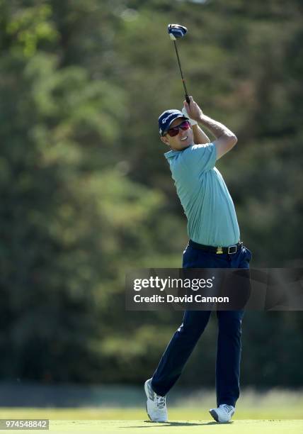 Justin Rose of England plays his tee shot on the sixth hole during the first round of the 2018 US Open at Shinnecock Hills Golf Club on June 14, 2018...