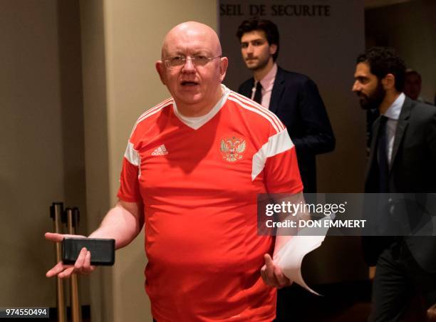 Vassily Nebenzia, wearing the Russian World Cup soccer jersey, leaves a Security Council meeting to brief the media on June 14, 2018 at the United...