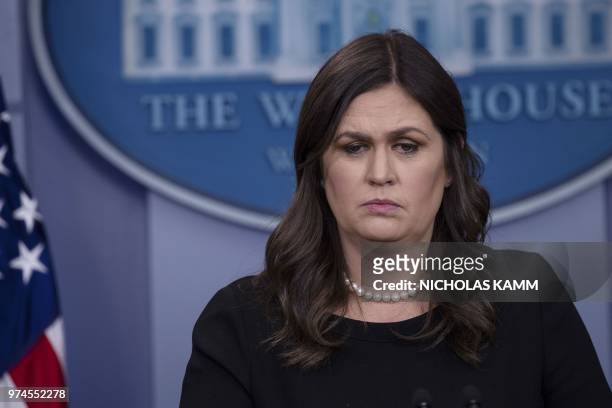 White House spokesperson Sarah Huckabee Sanders arrives at the press briefing at the White House in Washington, DC, on June 14, 2018.