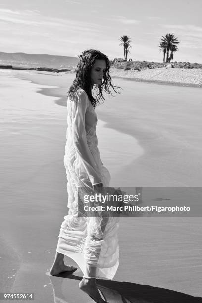 Model Elena Melnik poses at a fashion shoot for Madame Figaro on November 28, 2017 in Taghazout, Morocco. Dress by Jil Sander. PUBLISHED IMAGE....