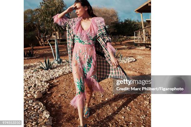 Model Elena Melnik poses at a fashion shoot for Madame Figaro on November 29, 2017 in Taghazout, Morocco. Trench , dress . Sandals . PUBLISHED IMAGE....