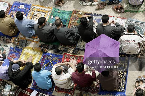 Iraqi Shiite muslims attend Friday prayer at Baghdad's Shiite bastion of Sadr City on March 5, 2010. Politicians launched into their last day of...