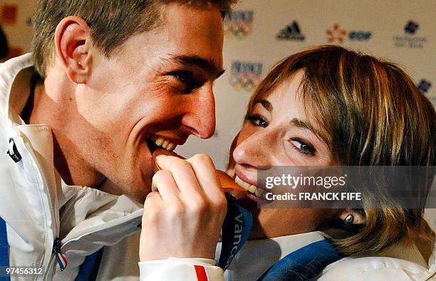 Biathlon French athletes Marie Laure Brunet and Vincent Jay pose with the bronze medals of the Vancouver 2010 Winter Olympics they won earlier in the...