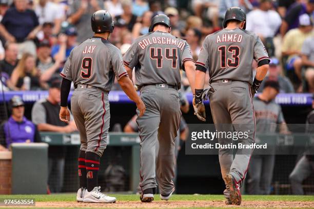 Paul Goldschmidt of the Arizona Diamondbacks celebrates with Nick Ahmed and Jon Jay after hitting a fourth inning 3-run homerun against the Colorado...