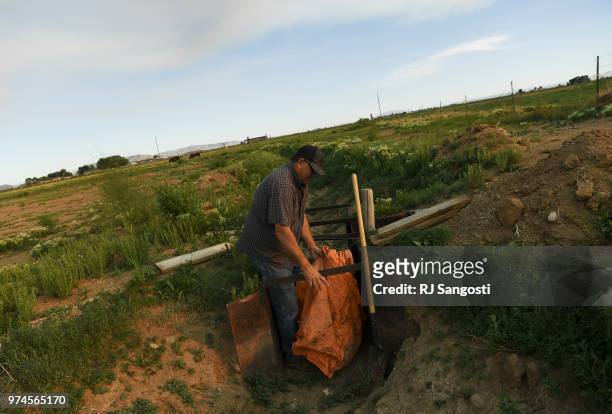 Cleave Simpson works on his alfalfa farm on June 10, 2018 in Alamosa, Colorado. Simpson is worried about water shortage in the area and was not able...