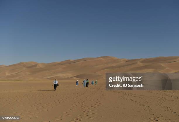 An Amish family from Ohio visit the Great Sand Dunes National Park on June 11, 2018 near Alamosa, Colorado.
