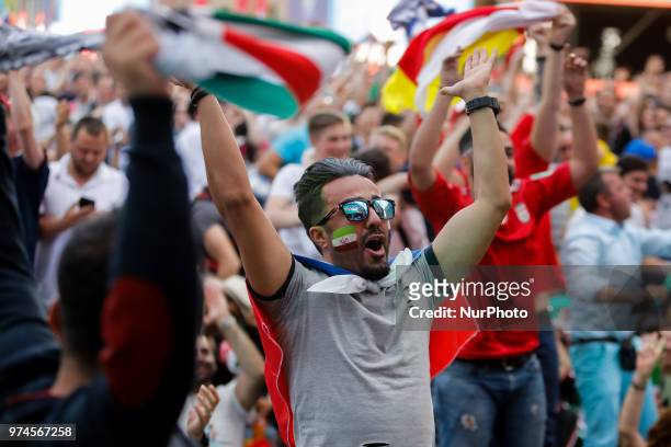 Supporters celebrate during the FIFA World Cup 2018 match between Russia and Saudi Arabia on June 14, 2018 at Fan Fest zone in Saint Petersburg,...