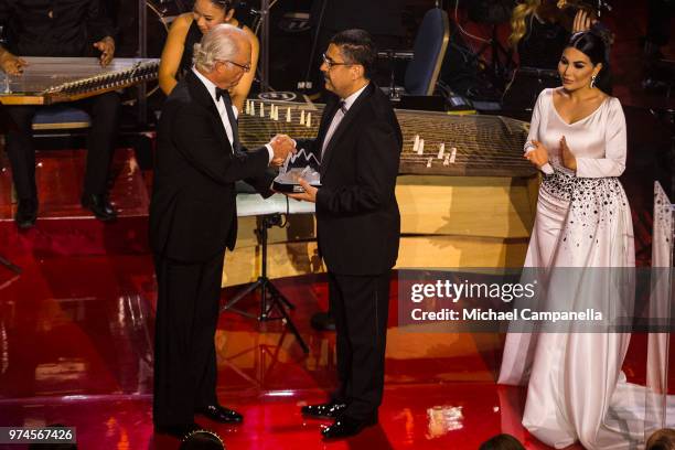 King Carl XVI Gustaf of Sweden presents Ahmad Sarmast with the 2018 Polar Music Prize award at the Grand Hotel on June 14, 2018 in Stockholm, Sweden.