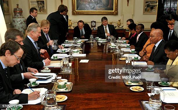 Britain's Prince Charles, Prince of Wales sits opposite South African President Jacob Zuma at Clarence House where a business-focused round table...