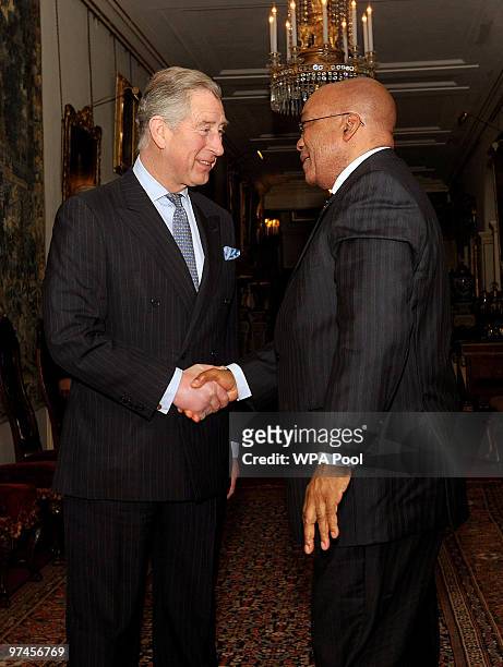 Britain's Prince Charles, Prince of Wales shakes hands with South African President Jacob Zuma as he arrives at Clarence House where a...