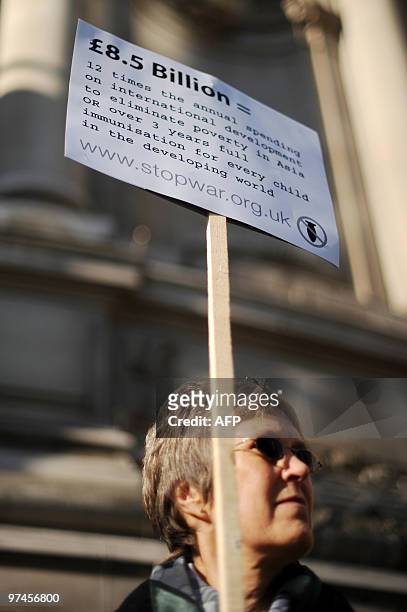 An anti-war protestor demonstrates outside the Queen Elizabeth Conference Centre in London, on March 5 as British Prime Minister Gordon Brown gives...