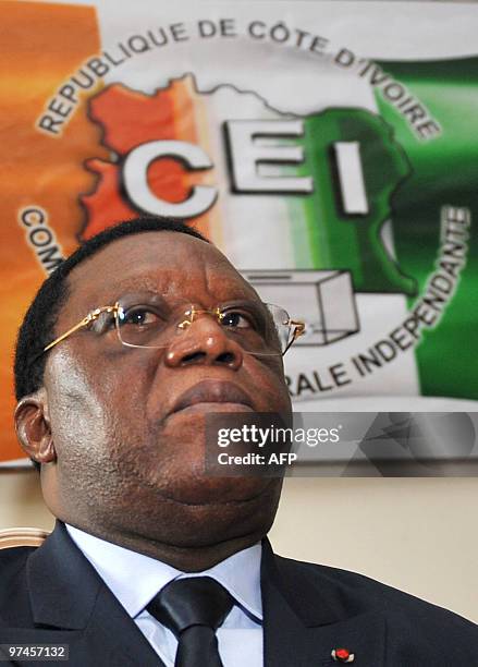 The new president of the Independent Electoral Commission , Youssouf Bakayoko poses at the CEI's headquarters, where he arrived for the handover...