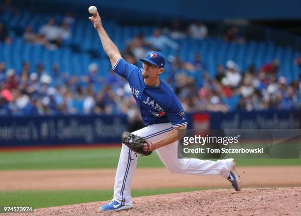 Tyler Clippard of the Toronto Blue Jays delivers a pitch in the eighth inning during MLB game action against the Baltimore Orioles at Rogers Centre...