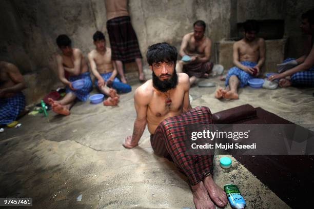 Afghan men and boys bathe in the hot room at a hammam on March 5, 2010 in Herat, Afghanistan. It is traditional for Afghans to visit the hammam on a...