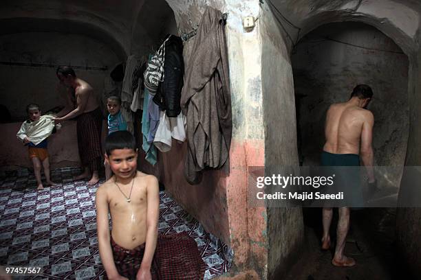 Afghan men and boys bathe in the hot room at a hammam on March 5, 2010 in Herat, Afghanistan. It is traditional for Afghans to visit the hammam on a...