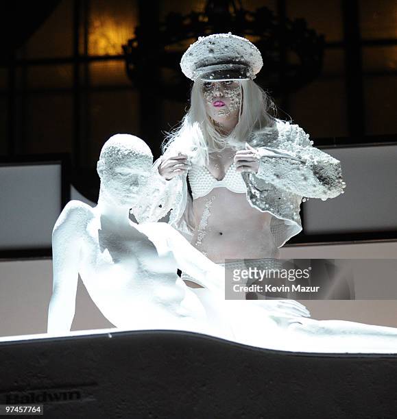Lady Gaga performs at AMFAR on a Terence Koh designed piano, inspired by the MáAáC Viva Glam campaign at Cipriani 42nd Street on February 10, 2010 in...