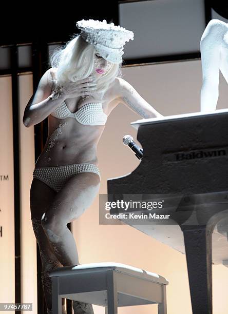 Lady Gaga performs at AMFAR on a Terence Koh designed piano, inspired by the MáAáC Viva Glam campaign at Cipriani 42nd Street on February 10, 2010 in...