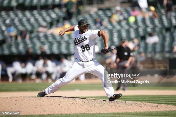 Yusmeiro Petit of the Oakland Athletics pitches during the game against the Tampa Bay Rays at the Oakland Alameda Coliseum on May 28, 2018 in...