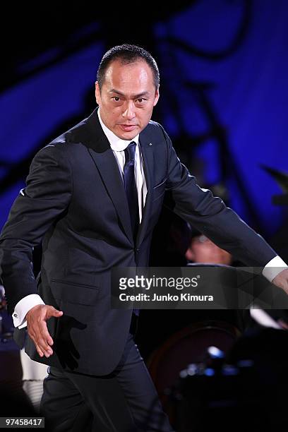 Actor Ken Watanabe reacts upon receiving the award for the best actor in a leading role for the film "Shizumanu Taiyou" during the 33rd Japan Academy...