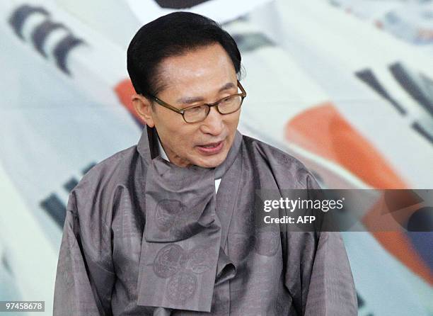 South Korean President Lee Myung-Bak greets people after his remembrance ceremony speech marking the 91st anniversary of the March First Independence...