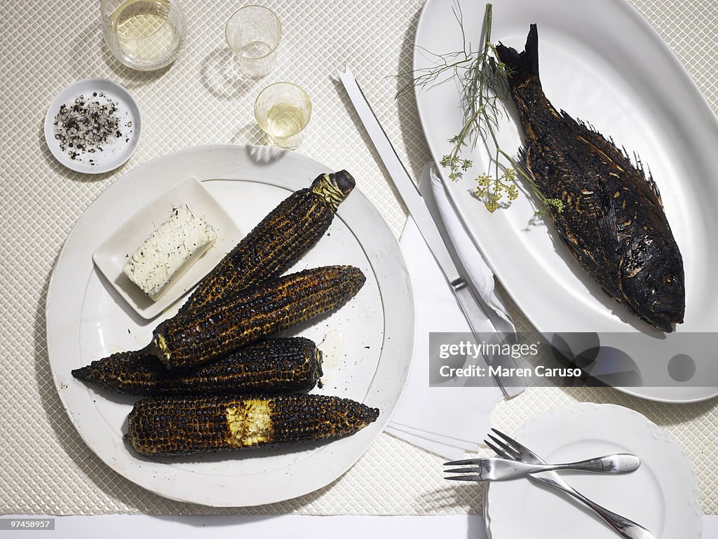 Burnt dinner of fish and corn
