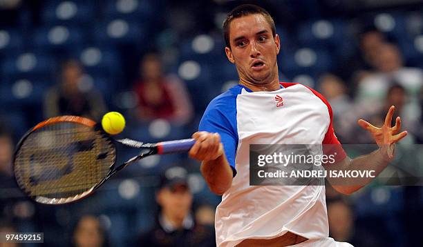 Serbia's Viktor Troicki returns the ball to John Isner of the US during their Davis Cup World Group first round tennis match on March 5 at Belgrade...