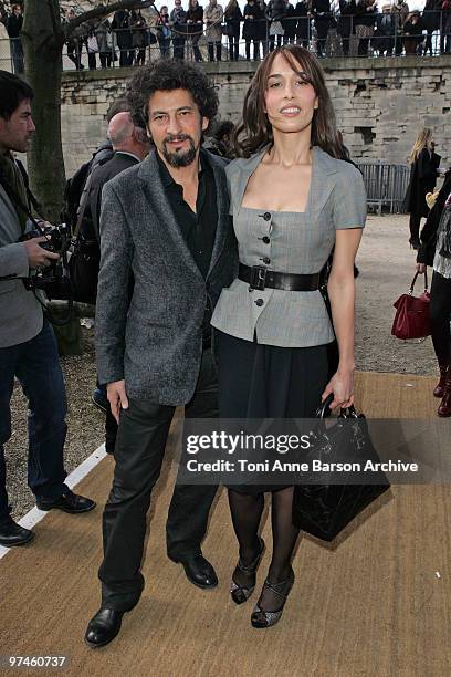 Dolores Chaplin and Radu Mihaileanu attend the Christian Dior Ready to Wear show as part of the Paris Womenswear Fashion Week Fall/Winter 2011 at...