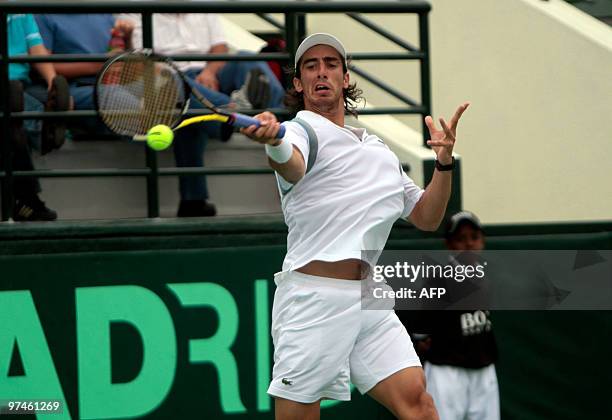 Uruguayan Pablo Cuevas returns the ball to Dominican Jose hernandez during their Copa Davis game in Santo Domingo, March 5, 2010. Cuevas won 6-2, 7-5...