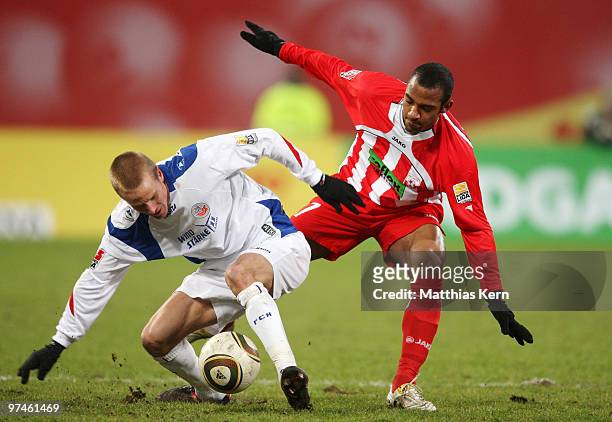 Andreas Dahlen of Rostock battles for the ball with Mohammed Lartey of Ahlen during the Second Bundesliga match between FC Hansa Rostock and...