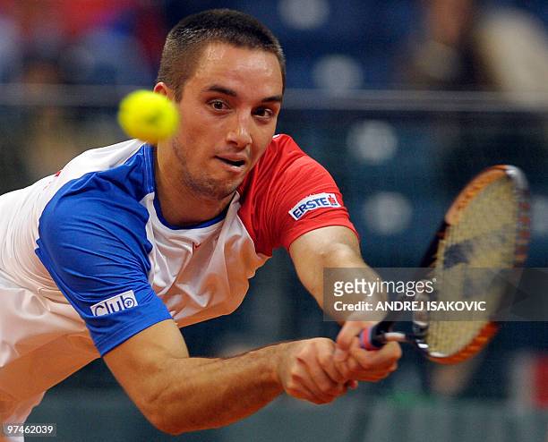 Serbia's Viktor Troicki returns the ball to John Isner of the US during their Davis Cup World Group first round tennis match on March 5 in Belgrade...