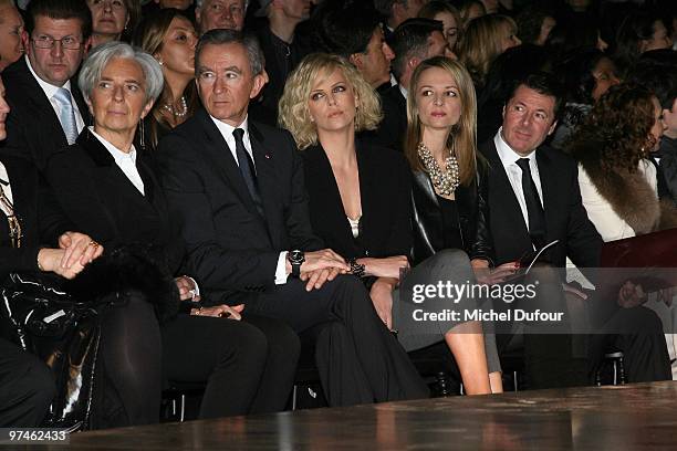 Christine Lagarde, Bernard Arnault, Charlize Theron and Delphine Arnault attends during the Christian Dior Ready to Wear show as part of the Paris...