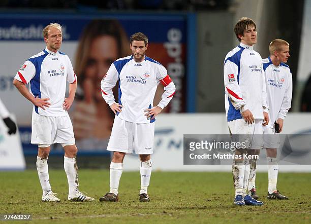 Tim Sebastian, Martin Retov, Kevin Pannewitz and Andreas Dahlen of Rostock show their frustration after loosing the Second Bundesliga match between...