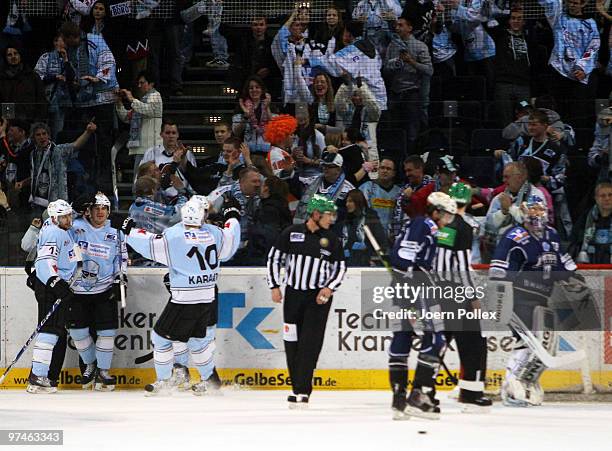 Vitalij Aab of Hamburg celebrates with his team mates after scoring his team's second goal during the DEL match between Hamburg Freezers and Iserlohn...