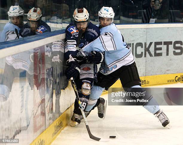 Maximilian Brandl of Hamburg challenges Daniel Sparre of Iserlohn during the DEL match between Hamburg Freezers and Iserlohn Roosters at the Color...