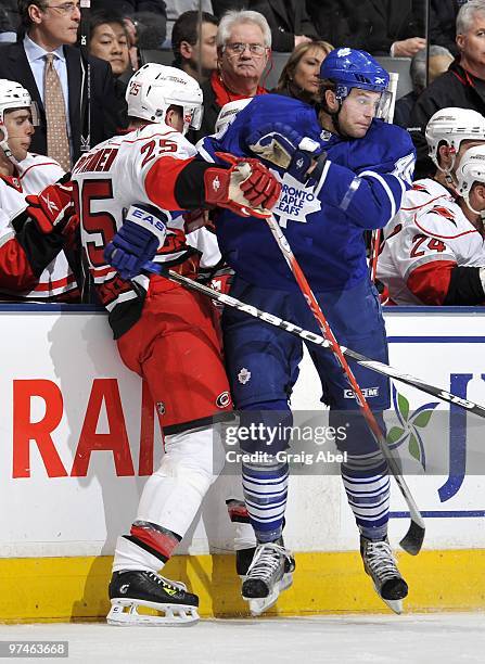 Viktor Stalberg of the Toronto Maple Leafs collides with Joni Pitkanen of the Carolina Hurricanes during the game on March 2, 2010 at the Air Canada...