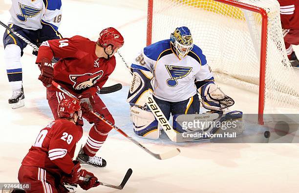 Goaltender Chris Mason of the St.Louis Blues makes a save on a redirected shot by Taylor Pyatt of the Phoenix Coyotes on March 2, 2010 at Jobing.com...
