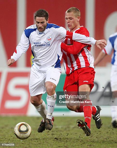 Martin Retov of Rostock battles for the ball with Michael Wiemann of Ahlen during the Second Bundesliga match between FC Hansa Rostock and Rot-Weiss...