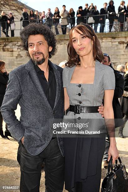Radu Mihaileanu and Dolores Chaplin attend the Christian Dior Ready to Wear show as part of the Paris Womenswear Fashion Week Fall/Winter 2011 at...