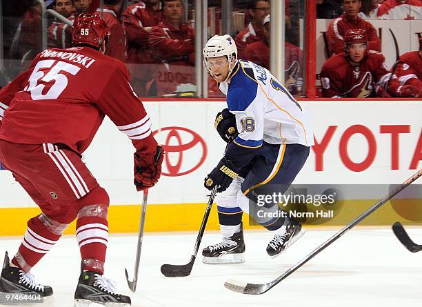 Jay McClement of the St.Louis Blues skates the puck up ice against the Phoenix Coyotes on March 2, 2010 at Jobing.com Arena in Glendale, Arizona.