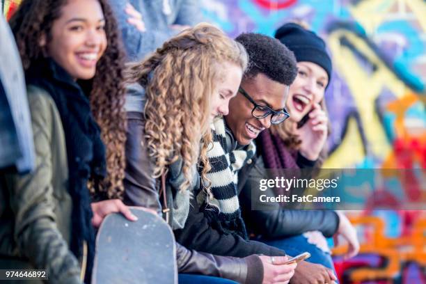 teens in urban environment - painted wall stock pictures, royalty-free photos & images