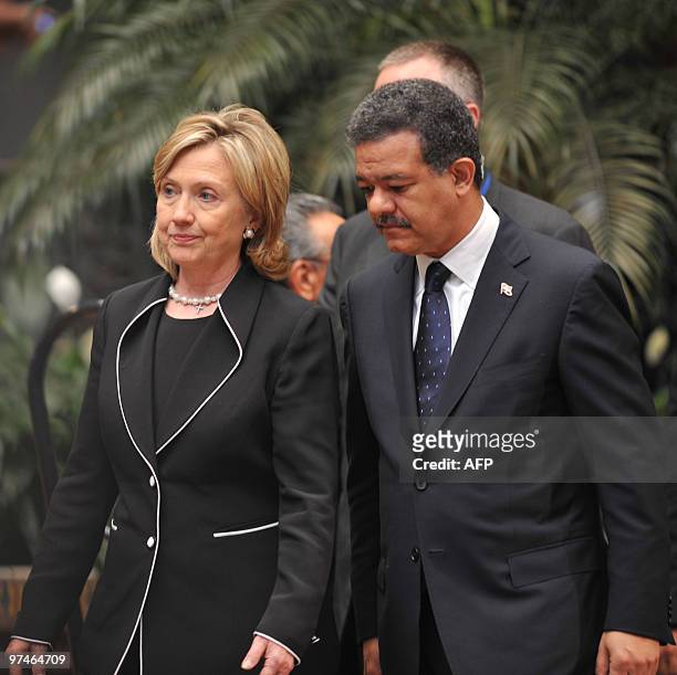 Secretary of State Hillary Rodham Clinton and Dominican President Leonel Fernandez chat as they pose for pictures at the National Palace of Culture...