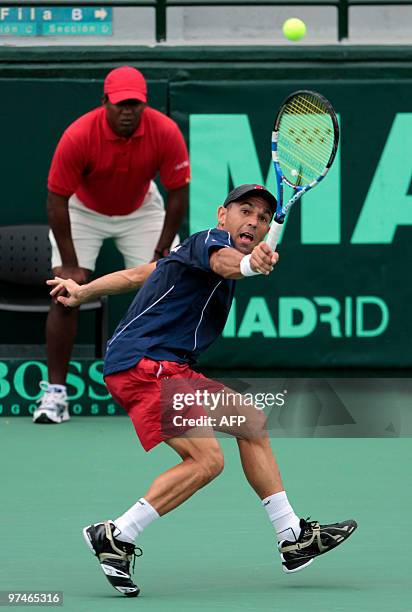 Dominican Victor Estrella tennis player returns the ball against Uruguayan Marcel Felder during their Copa Davis match in Santo Domingo on March 5,...