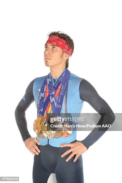Olympic Short Track Speed Skater Apolo Anton Ohno of the United States poses with his eight Winter Olympic medals during a photo shoot on March 3,...