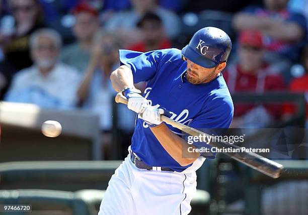 David DeJesus of the Kansas City Royals hits a single against the Texas Rangers during the first inning of the MLB spring training game at Surprise...