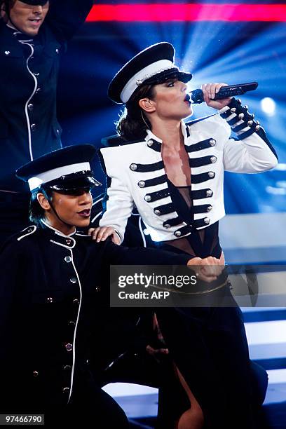 British singer Cheryl Cole performs on stage during the Danish X-Factor show on Danish television in Copenhagen on March 5, 2010. AFP PHOTO Esben...